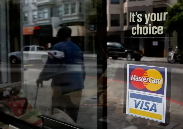 Visa, Mastercard reach legal pact with merchants